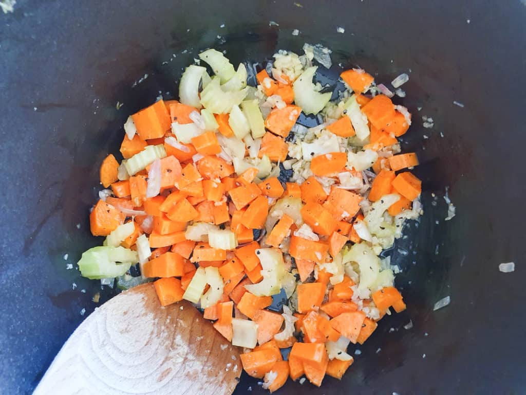 Cooking carrots and celery for a lentils recipe