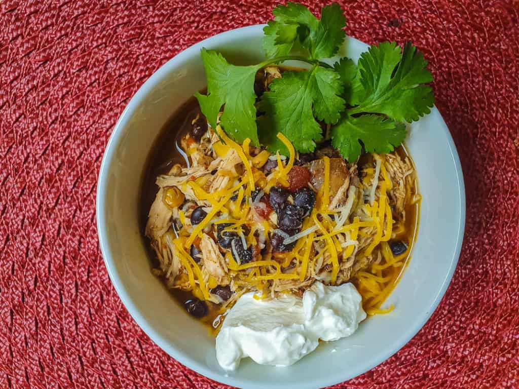 Chicken chili with cheese and sour cream